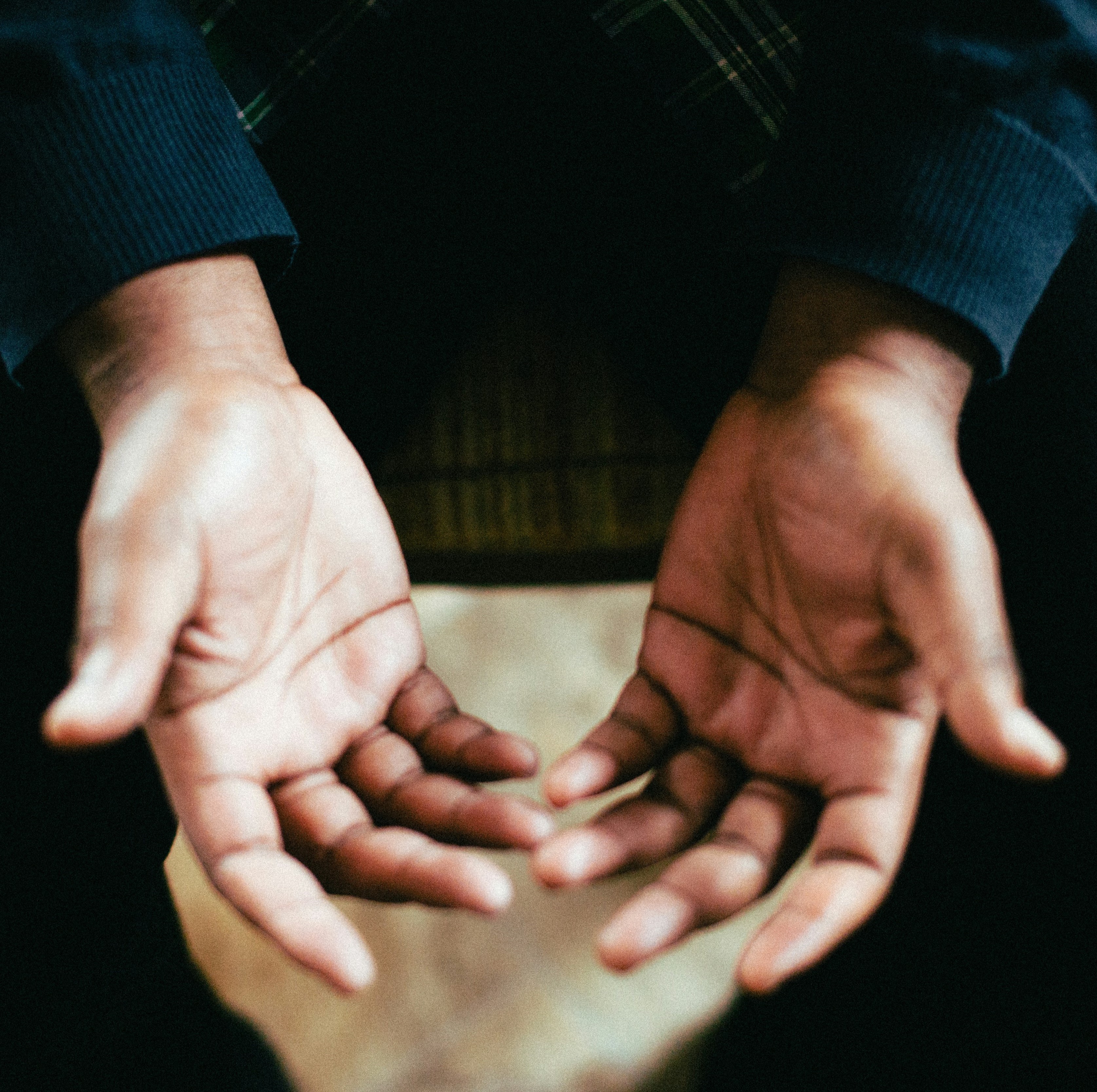 two outstretched hands, palms up. Photo by Jeremy Yap, 2017 https://unsplash.com/photos/person-showing-both-palms-while-sitting-on-chair-eCEj-BR91xQ